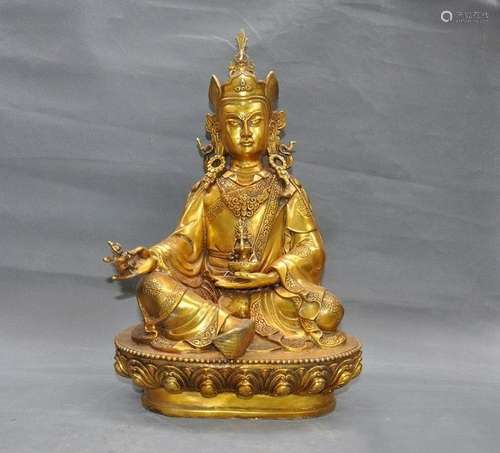 A GILT BRONZE GURU RINPOCHE BUDDHA FIGURE QING DYNASTY.