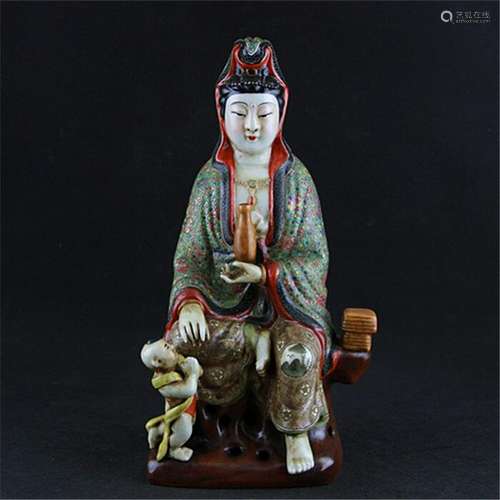 A PORCELAIN ENAMEL BUDDHA FIGURE QING DYNASTY 17TH/C.