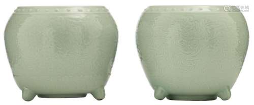 A pair of Chinese celadon glazed tripod cachepots,