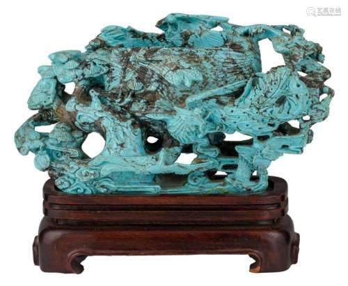 A turquoise brushwash relief decorated with various