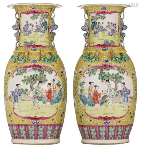 A pair of Chinese yellow ground famille rose vases, the