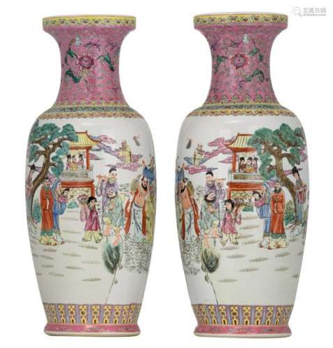 A pair of Chinese famille rose vases, decorated with an