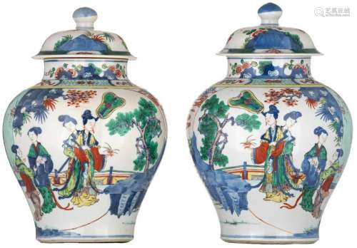 A pair of Chinese famille verte vases and covers,
