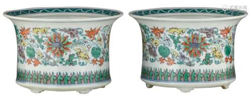 A pair of Chinese doucai cachepots, decorated with