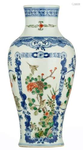 A Chinese blue and white baluster shaped vase, famille