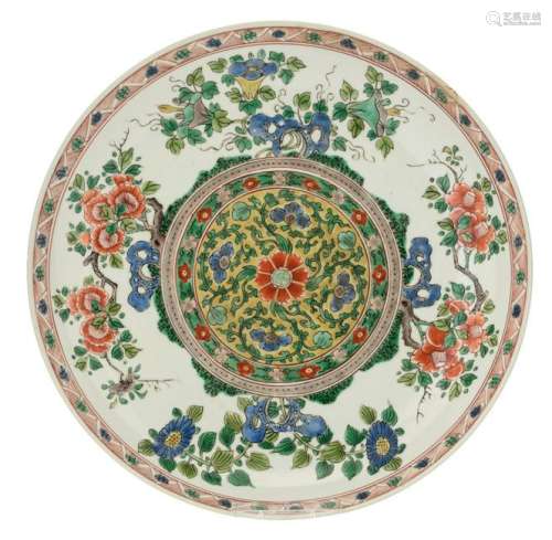 A Chinese famille verte plate, the well decorated with