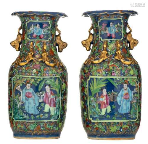 A pair of Chinese blue ground famille rose vases with