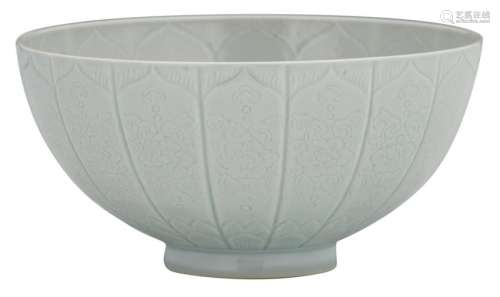 A Chinese relief decorated white glazed 'lotus' bowl