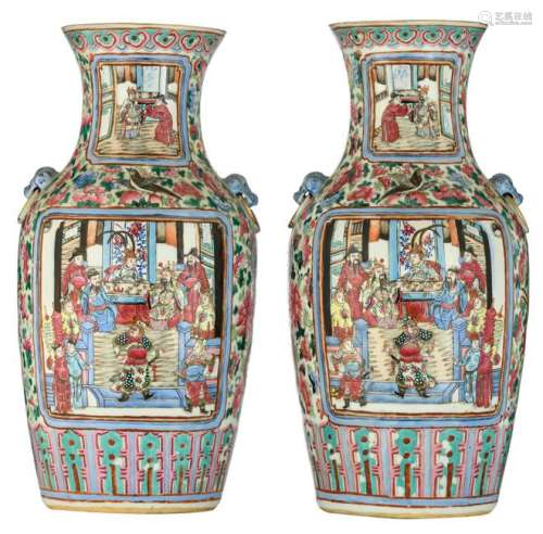 A pair of Chinese famille rose vases, the roundels with