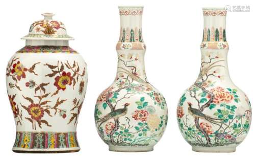 A pair of Chinese famille rose bottle vases, decorated