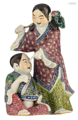 A Chinese polychrome porcelain group, depicting two