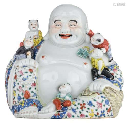 A Chinese polychrome seated Budai with children, with
