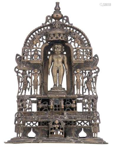 A bronze Hindu altar shrine with a standing deity in