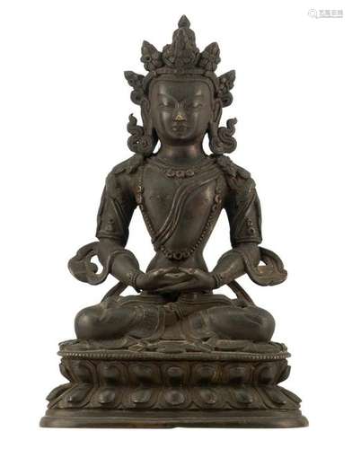 A patinated bronze Buddha, his hands in Dhyana mudra,