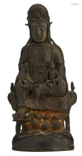 A bronze seated Guanyin on a lotus, holding a boy, H