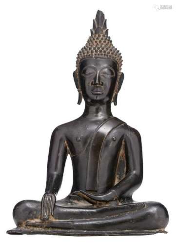 A South East Asian bronze seated Buddha with black