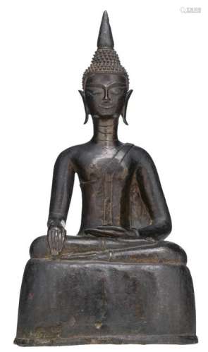 A bronze seated figure on a ditto base, depicting a