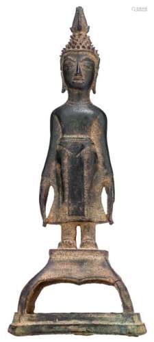 An Oriental standing bronze figure of a Buddha, on a