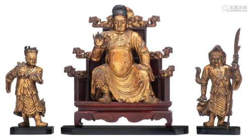 An Oriental gilt wooden seated figure on a throne,