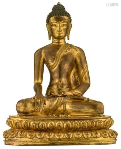 A Chinese gilt bronze seated Buddha on a lotus base, H