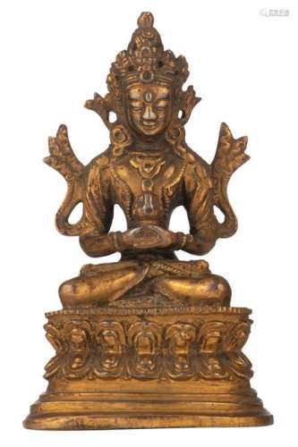 A gilt bronze Buddha holding his hands in Dhyana mudra,