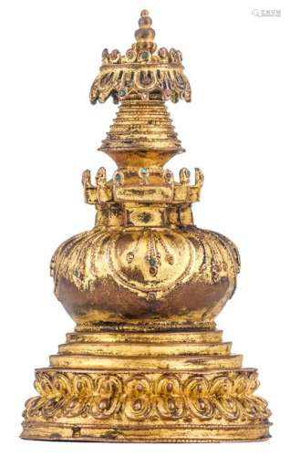 A Tibetan turquoise and coral-inlaid gilt copper stupa,