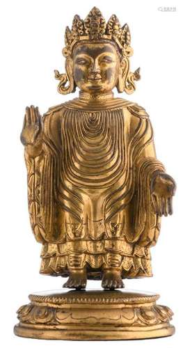 A Sino-Tibetan gilt bronze Buddha, the garment draped