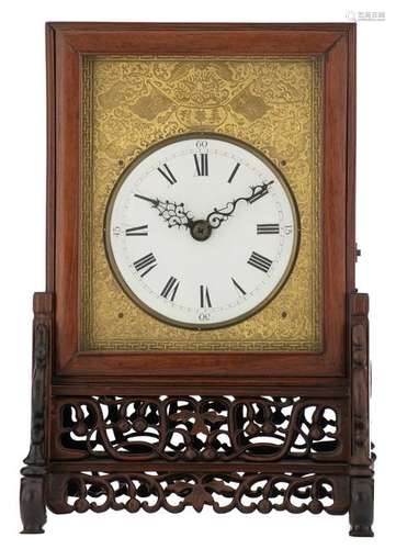 A Chinese gilt bronze table clock in a sculpted