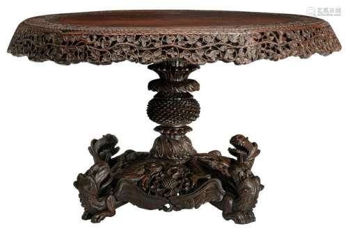 An Oriental richly carved hardwood table, H 76 - Ã¸ 136