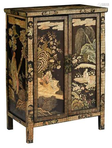 A Chinese polychrome lacquered cupboard, decorated with