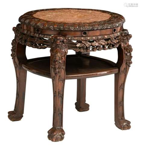 A Chinese richly carved exotic hardwood base with a