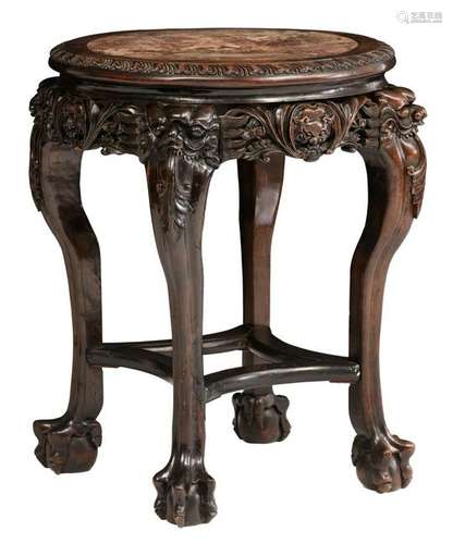 A Chinese richly carved hardwood soccle with a marble