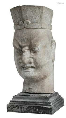 The head of a temple guard, sculpted hardstone, on a