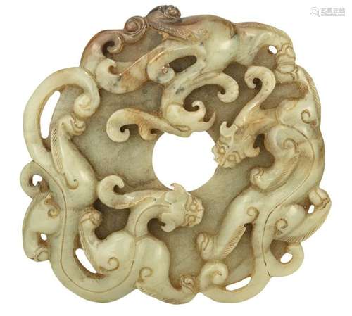 A Chinese russet jade Bi disc, alto relievo decorated