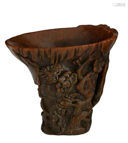 A richly carved Chinese libation cup, continuous