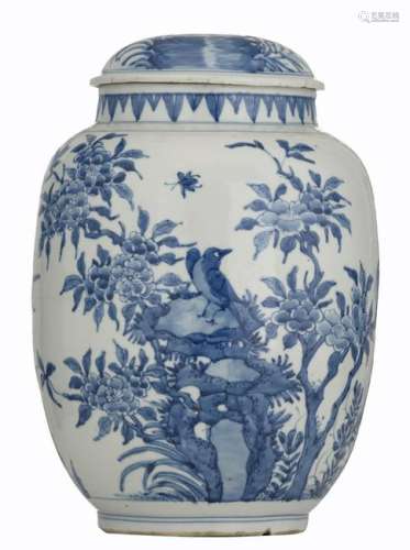 A blue and white covered pot decorated with birds