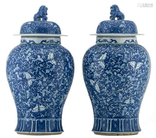 A pair of Chinese blue and white vases and covers,