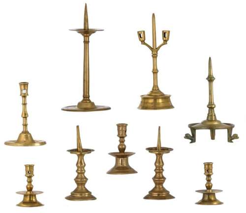 A lot of various types of bronze candlesticks, 17th -