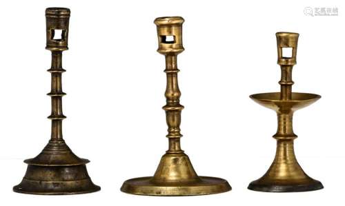 A lot of three various bronze candlesticks, 16th/17thC,
