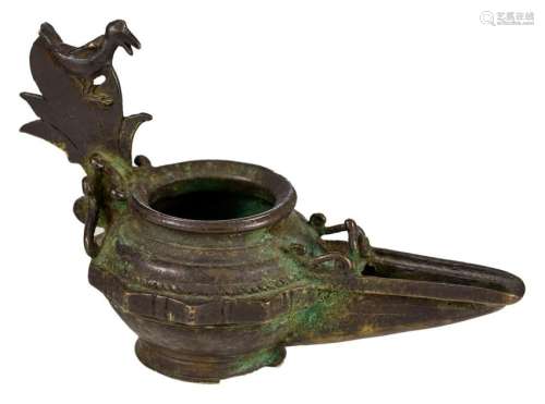 A bronze Khorasan type oil lamp, the grip moulded as a