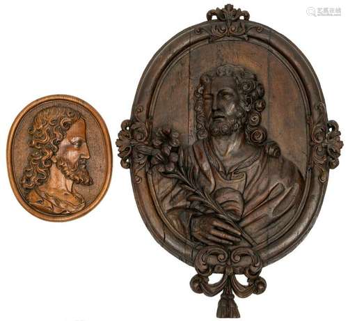 A large oval-shaped oak basso-relievo depicting Saint