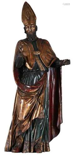 An oak sculpture ofÂ Saint Augustine holding a flaming