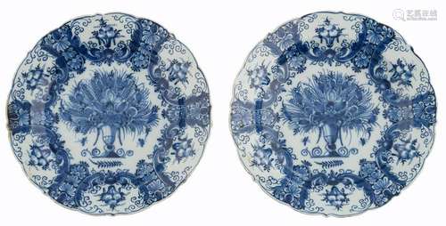 Two fine Delftware plates with a fluted rim, decorated