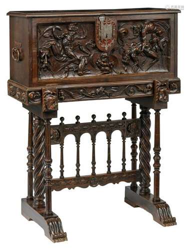 A richly alto relievo carved walnut and oak vargueno,