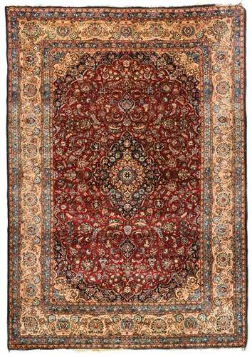 An Oriental rug, wool and silk on cotton, decorated