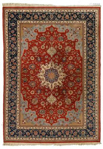 An Oriental woollen rug, floral decorated, with a