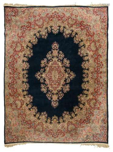 An Oriental woollen rug, decorated with floral motifs