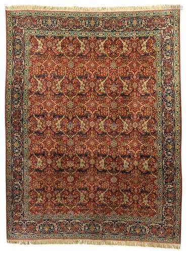 An Oriental woollen rug, decorated with floral and