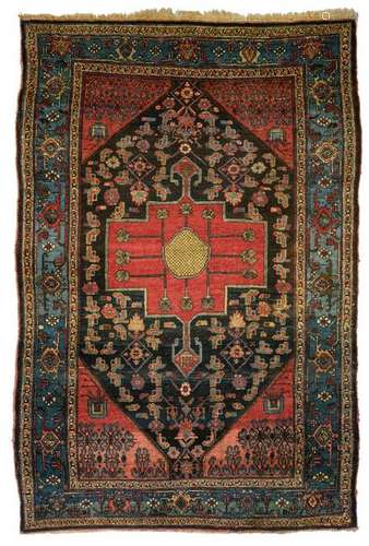 An Oriental woollen rug, decorated with stylised