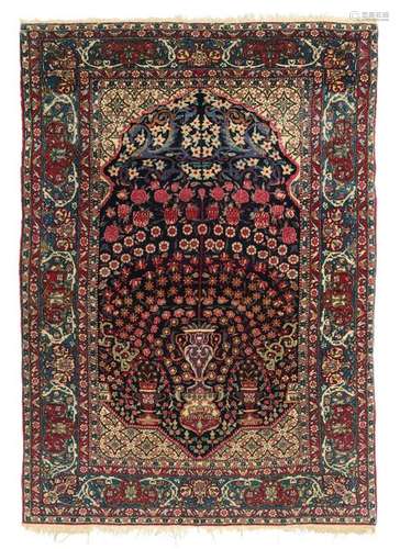 An Oriental woollen rug, decorated with flowers and